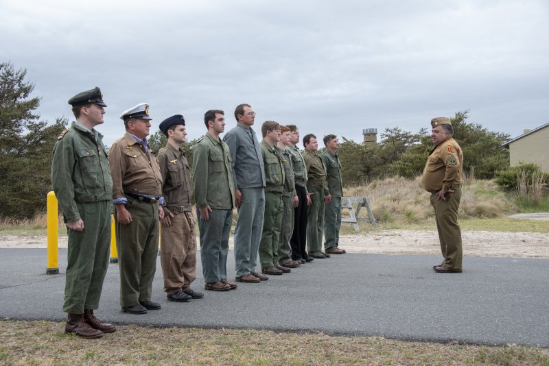With the World War II tower as a backdrop, reenactors portray German submarine soldiers arrested during Fort Miles Defense Day.